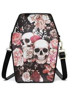 Detailed view of coffin-shaped crossbody bag featuring gothic skull and rose patterns