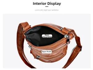 Top view of vintage brown leather crossbody bag showing main compartment and zipper pockets