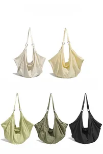 Collection of nylon hobo bags in cream, yellow, green and black with waffle textures