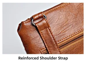 Detail of brown litchi leather bag showing reinforced stitching and metal buckle