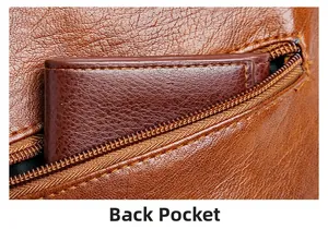 Detail of back zipper pocket on brown pebbled leather crossbody bag showing storage space