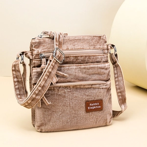 Retro brown washed canvas crossbody bag with multiple zippers and adjustable strap
