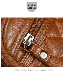Detail of silver zipper closure and quilted stitching on brown soft leather shoulder bag