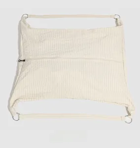 Macro detail of expandable water-resistant casual shoulder bag with check pattern and metal rings