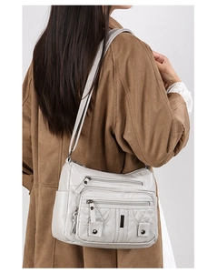 Side view of large capacity washed soft leather crossbody bag with quilted pattern