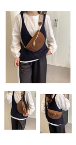 Brown suede belt bag featuring adjustable patterned strap and gold hardware detail