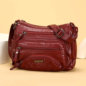 Fashionable dark red soft leather crossbody bag with multiple zipper pockets and quilting
