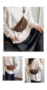 Brown suede half-moon belt bag with golden zippers and geometric jacquard woven strap