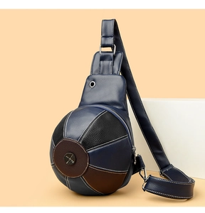 Detail of creative basketball-shaped crossbody bag with blue and brown lychee leather