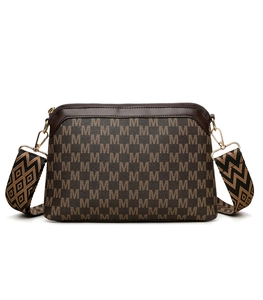 Detail of vintage crossbody bag with brown monogram pattern and textured jacquard strap