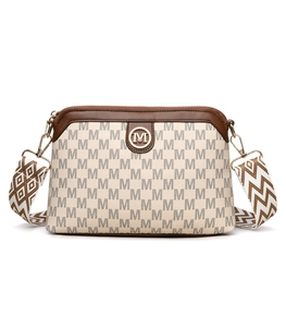 Close-up of vintage printed crossbody bag with golden metal M logo and patterned strap