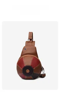 Detailed view of basketball-style crossbody bag with multi-tone brown pebble leather