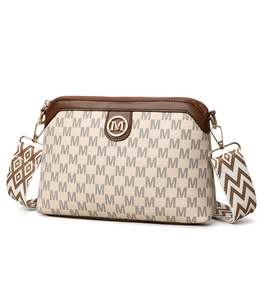 Detail of vintage floral shoulder bag with golden logo and woven geometric strap