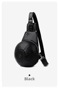 Detail of creative basketball-shaped chest bag in black pebbled leather with silver zipper