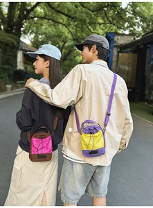 Detail view of colorful nylon water bottle bags with drawstring and adjustable strap