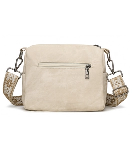 Close-up of off-white canvas bag with back zipper pocket and star pattern strap