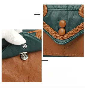 Detail of soft leather shoulder bag showing woven edges and magnetic buckle closure