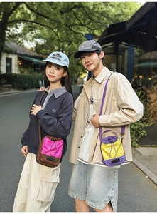 Detail of outdoor functional drawstring crossbody bag with durable nylon texture and logo
