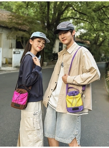 Detail of colorful nylon bucket bags with drawstring and adjustable shoulder straps