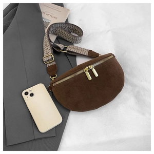 Detail of coffee brown suede crossbody bag with gold zippers and jacquard ethnic strap