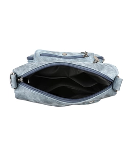 Top view of multi-compartment denim crossbody bag showing internal storage and zippers