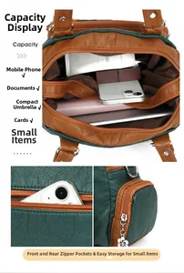 Detailed interior storage showing multi-pocket compartments of the contrast leather handbag