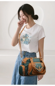 Detail view of large capacity multi-pocket crossbody bag with vintage color-block design