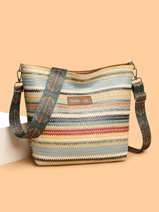 Detail of colorful bohemian striped woven tote bag with Perfect Lily leather label