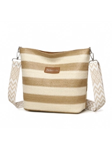 Detail of woven tote bag featuring brown stripes and a geometric jacquard shoulder strap