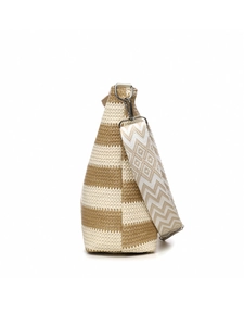 Detail of woven straw tote bag with geometric ethnic strap and ivory khaki stripes