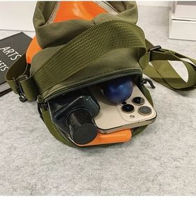 Internal view of the army green nylon crossbody bag showing ample storage space