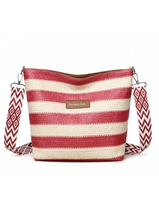 Detail of red and white striped woven tote bag with Perfect Lily leather label