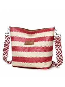 Detail of red and white striped woven tote bag with a wide patterned strap and leather logo
