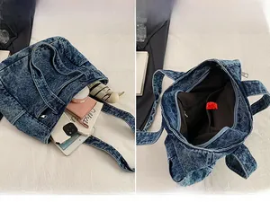 Detail view of denim tote bag showing spacious interior and daily essentials organization