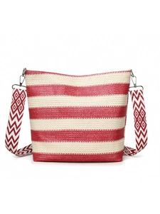 Detail of red and white striped woven tote bag with adjustable zigzag shoulder strap