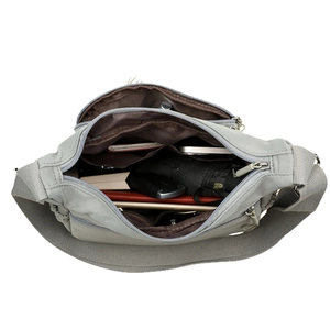 Light gray nylon crossbody bag with large capacity showing multiple storage compartments