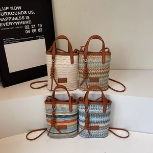 Artistic hand-woven straw bucket bags in four colors with leather handles for summer beach