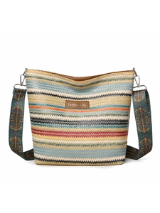 Detail of multi-color striped woven tote with Perfect Lily leather patch and patterned strap