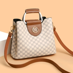 Sac à main vintage monogramme beige avec garniture en cuir marron et poignée métal