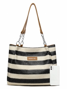 Detail of striped woven tote bag with leather handles and metal chain accents