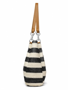Detail of woven straw tote bag featuring black and white stripes and brown leather straps
