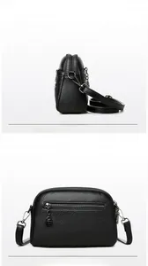 Detailed views of a black lychee-grain leather crossbody bag with silver hardware