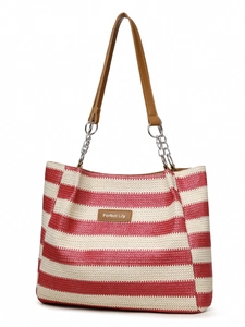 Detail of red and white woven tote bag with silver chain handles and leather logo