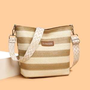 Striped woven shoulder bag with wide jacquard strap and leather patch on beige background