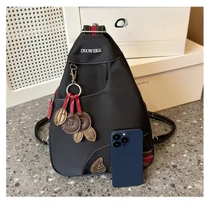 Detailed view of water-resistant nylon chest bag with phone for size comparison