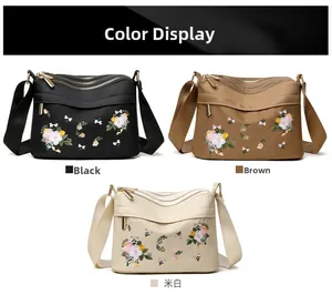 Three nylon crossbody bags with floral embroidery and triple zipper compartments