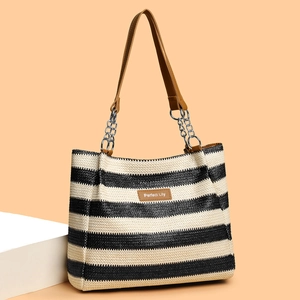 Large woven tote bag with black and white stripes and leather chain straps for daily commute