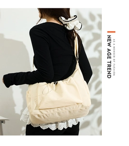 Rear view of a model wearing the cream canvas tote bag with functional drawstring pocket