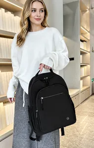 Close-up of lightweight black hiking backpack with waterproof nylon and zipper pockets