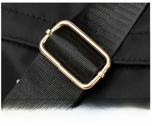 Detail of adjustable golden metal buckle and high-density woven nylon shoulder strap